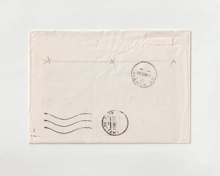 Ilustrasi mimpi surat — a piece of paper with a stamp on it