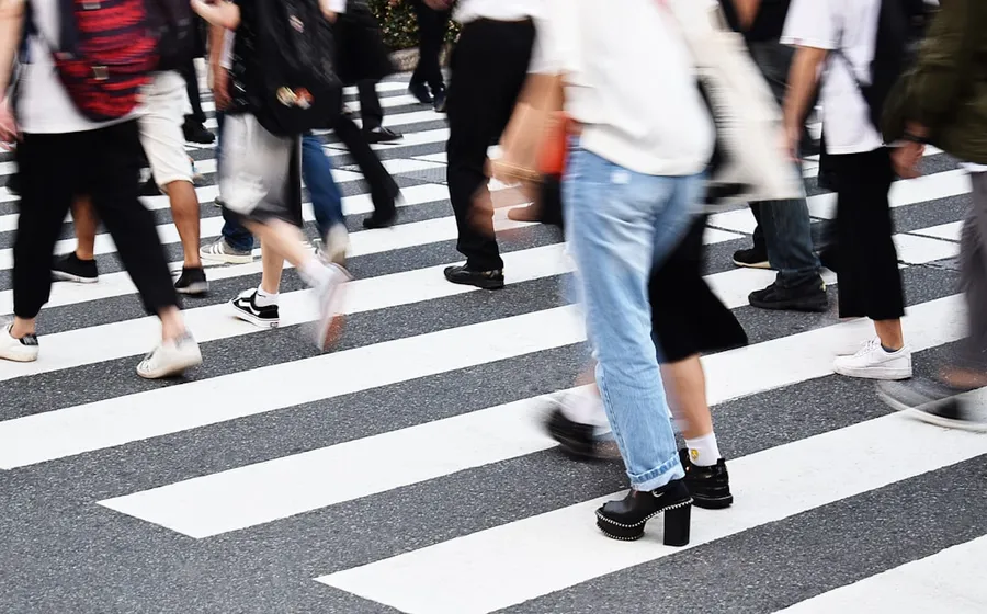 Ilustrasi mimpi terlanggar — people walking on pedestrian lane during daytime